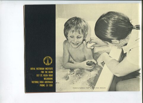Picture of a boy having a bath assisted by a nurse