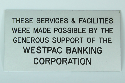 Silver coloured plaque with black wording