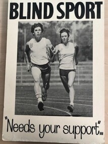 Two people running on athletic track holding a tether between them