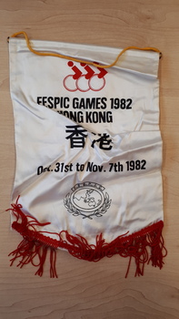 White satin mini banner with black writing and red fringing