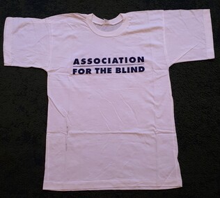 White tee shirt with navy blue writing across chest