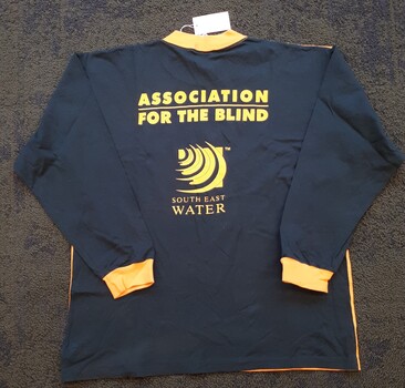 Green back with yellow writing 'Association for the Blind' South East Water