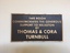 Brown plaque with raised copper letters