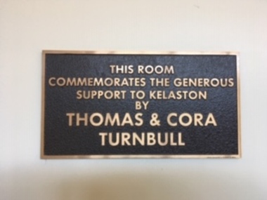Brown plaque with raised copper letters