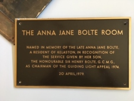 Brown plaque with raised copper letters