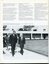 Sir Roden Cutler and President Albert walk past the bowling green.