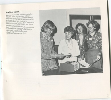 Deniliquin auxiliary President Mrs Collins shows a talking book machine to ladies of the Well-Come club