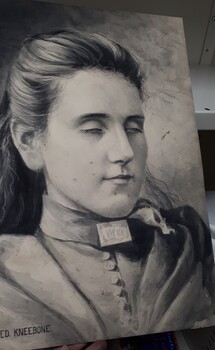 Charcoal drawing of women's head and shoulders