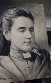Charcoal drawing of women's head and shoulders
