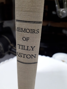 Image of light tan book spine with black writing