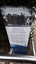 Blue and white sign with black and white image