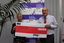 Tracy Larsen White and Vision Australia CEO Ron Hooton holding an oversized cheque