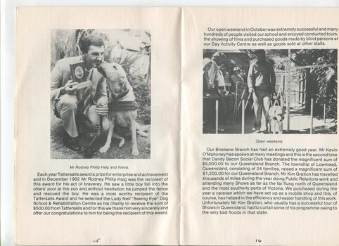 Rodney Haig being thanked by a Seeing Eye dog for his donation and the open weekend held at the school