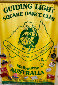 Yellow satin banner with badges attached