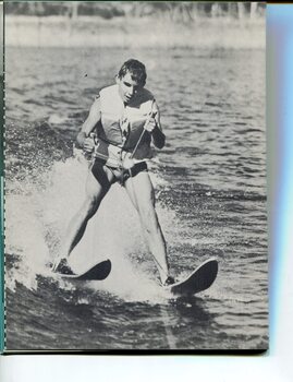 Young man waterskiing on a lake