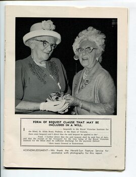 Alberta Tutton with another older female and a pile of 25 year badges for Auxiliary members