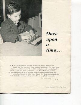 Young schoolboy handwriting Braille with slate, guide rule and stylus