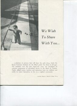 Young boy holding on to railing as he walks along path