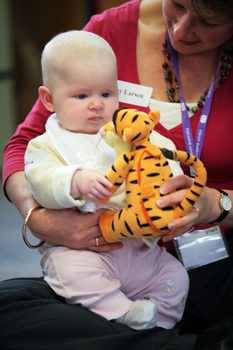 Baby Jessica plays with a Tigger soft toy held by ? Larsen