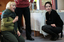 Sigrid Thornton kneeling as she speaks to another woman sitting on the floor of the Feelix library