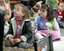 Amelia and Claudia wait for story time to begin on the mat at the Feelix library