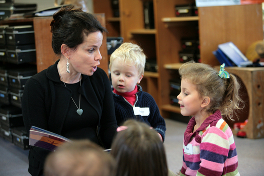 Sigrid Thornton reading Goodnight Lulu to the children, including Kate and a young boy