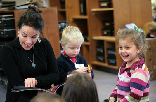 Sigrid Thornton reading Goodnight Lulu to the children, including Kate and a young boy