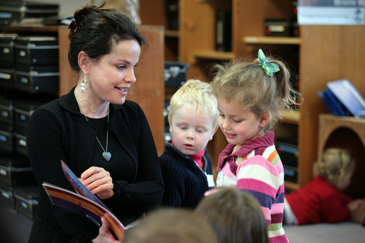 Sigrid Thornton reading Goodnight Lulu to the children, including Kate and a young boy