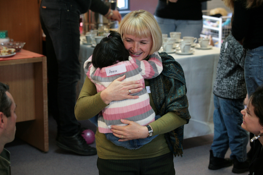 Anna giving a big hug to an older lady in the Feelix library