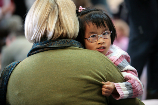 Anna giving a big hug to an older lady in the Feelix library