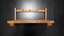 Wooden triangular stand with three red leather hooks across bar at top of stand