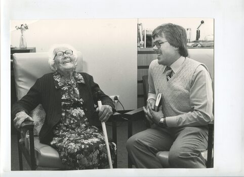 Terry Fraser laughs with resident Evelyn Grace Bryant