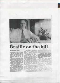 Text with image of Neil Maxwell reading Braille at home