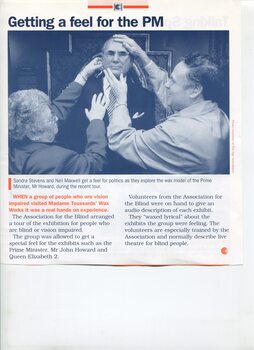 Sandra Stevens and Neil Maxwell feeling the wax face of Prime Minister John Howard