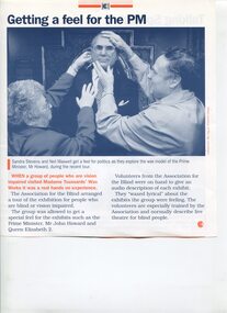 Sandra Stevens and Neil Maxwell feeling the wax face of Prime Minister John Howard
