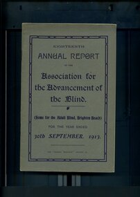 Grey front cover with navy blue writing