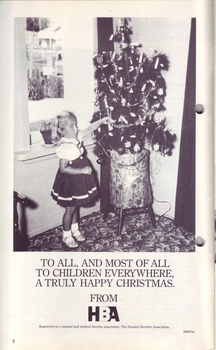 Young girl grabbing something off a Christmas tree looks guilty to camera - HBA Christmas greetings