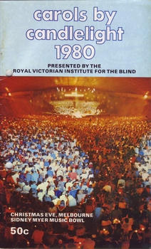 Crowd under spotlights, facing the stage