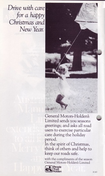 Young girl runs across a park holding a kite and Christmas message from General Motors Holden