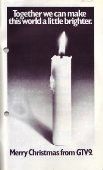 Photograph of lit candle with Christmas message from GTV 9