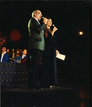 Jill Perryman and Neil Warren Smith singing on stage