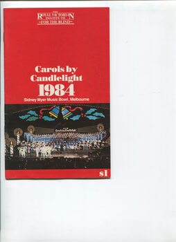Colour image of stage with giant candle lights on stage and Humphrey B Bear with dancers