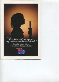 Picture of girl in shadow, holding a candle, with Christmas message from 3AW