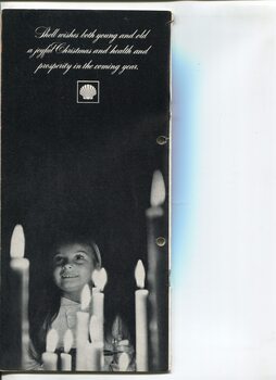 Christmas message from Shell and photo of young girl looking upward behind some candles