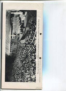 Side view of audience and performers on stage during the concert