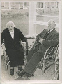Elderly lady and man sit near the window at Mirridong.