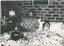 Barry Farnsworth with male friend and an Australian cattle dog sitting on the bed