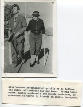 Alex walking with an elderly female companion