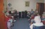 Group of residents during a sing a long with pianist and piano