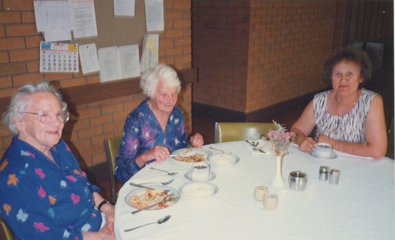 Two residents and a staff member having lunch at Woodburn Lodge